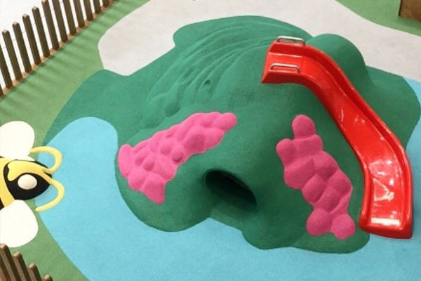 Green Rubber Grass With Red Slide - Tuggerah Super Centre