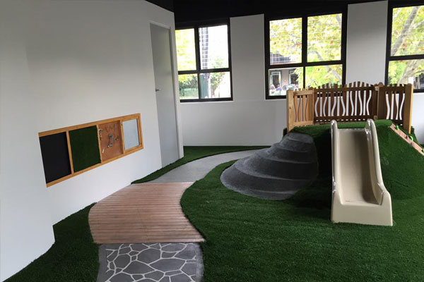 White Slide With Fake Grass Floor - Little Learning School Surry Hills