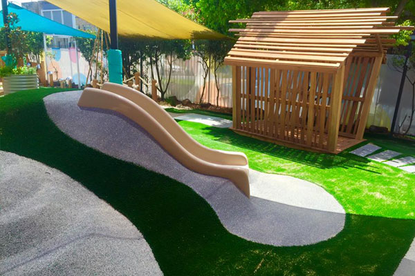 White Soft Pour Rubber Slide Artificial Turf - Little Learning School In Leichardt